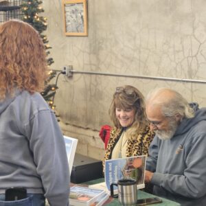 Charlie Abowd signs his book Recipes and Rambles